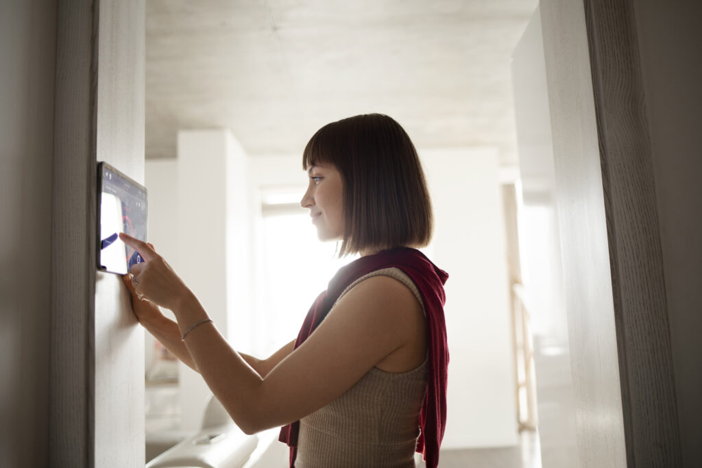 young woman using home technology